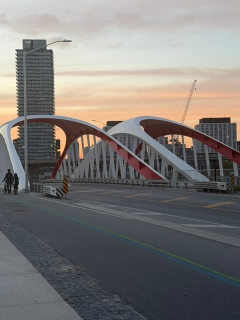 Sunset over the Cherry Street red-arched bridge in Toronto's Port Lands — one of the GTA's many neighbourhoods Rose works across